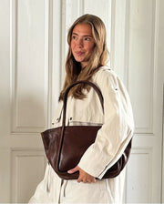 ruskea nahkalaukku treats aino